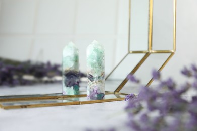 Photo of Aura. Beautiful fluorite and lavender on white table