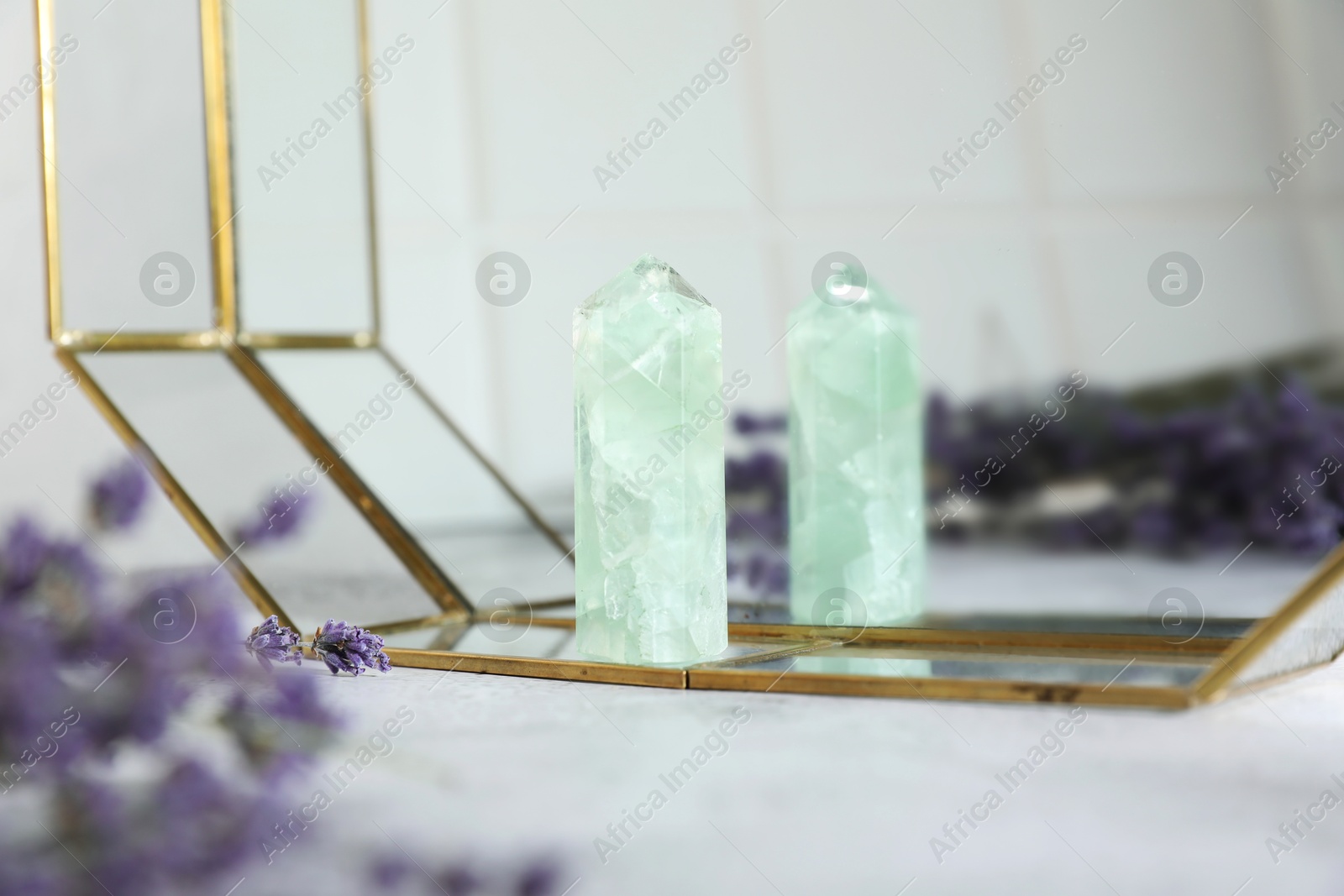 Photo of Aura. Beautiful fluorite and lavender on white table, closeup