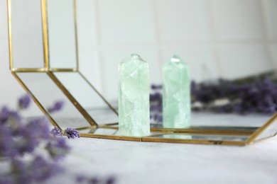 Photo of Aura. Beautiful fluorite and lavender on white table, closeup
