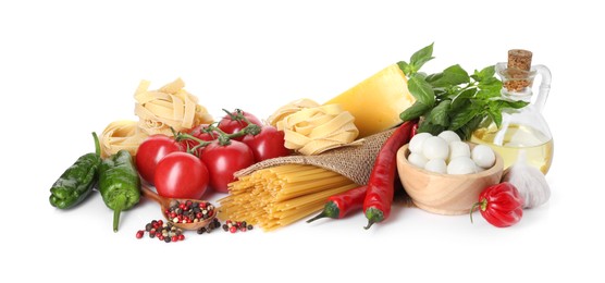 Photo of Different types of pasta and ingredients isolated on white