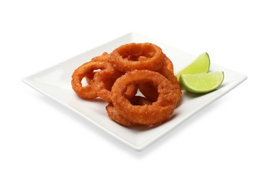 Photo of Fried squid rings and lime isolated on white