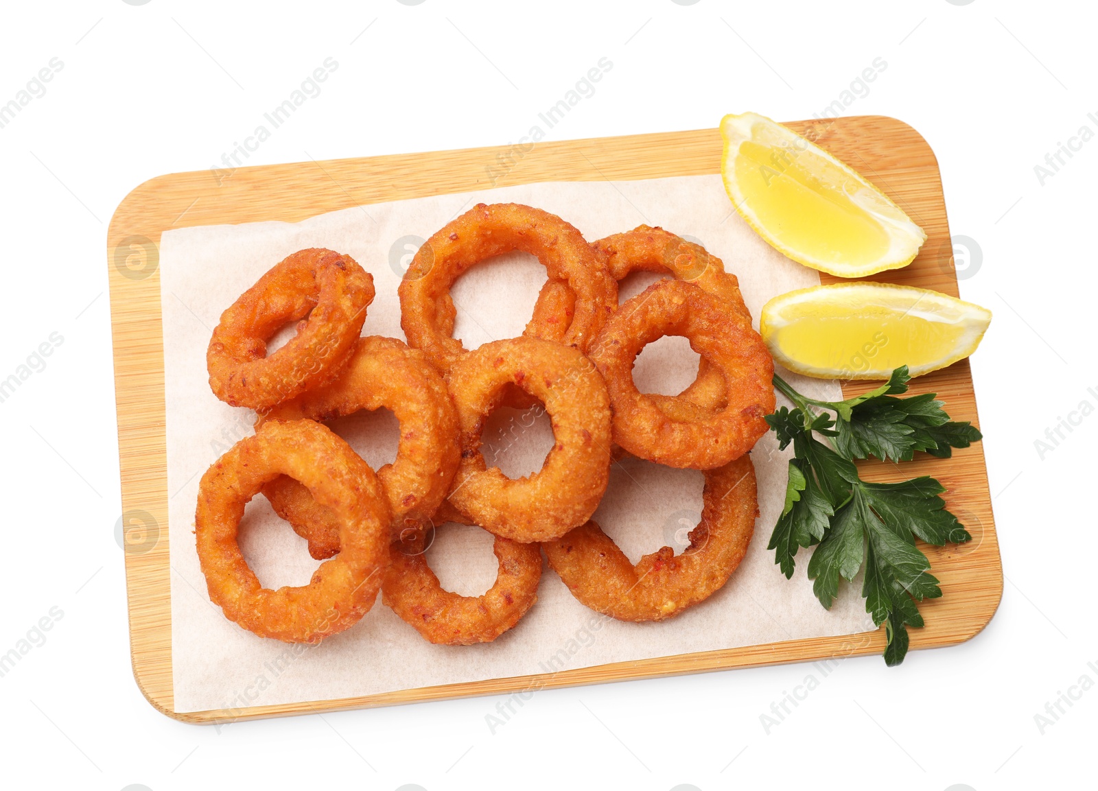 Fried squid rings with parsley and lemon isolated on white, top view Photo of Fried squid rings with parsley and lemon isolated on white, top view