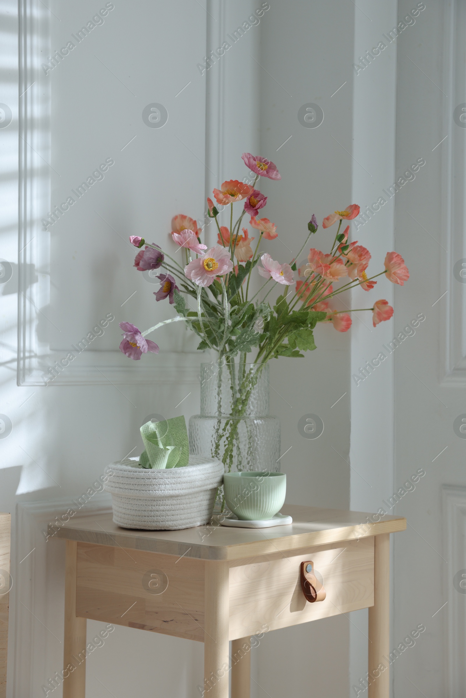 Photo of Bedside table with different decor at home
