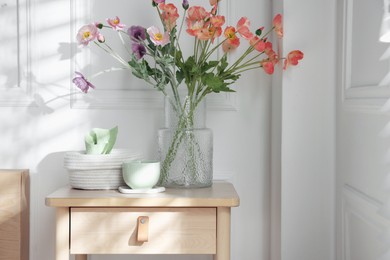 Photo of Bedside table with different decor at home