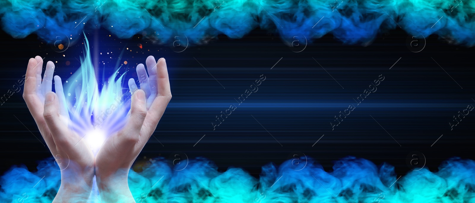 Man creating bright light in smoke against black background, banner design. Aura, spiritual practice Image of Man creating bright light in smoke against black background, banner design. Aura, spiritual practice