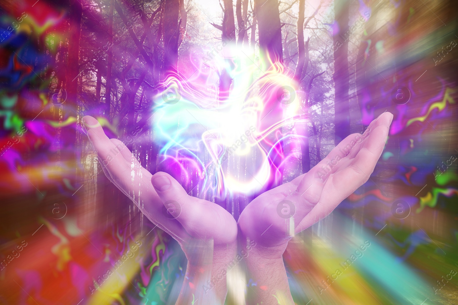 Image of Woman holding glowing iridescent sphere in forest, closeup. Aura, spiritual practice