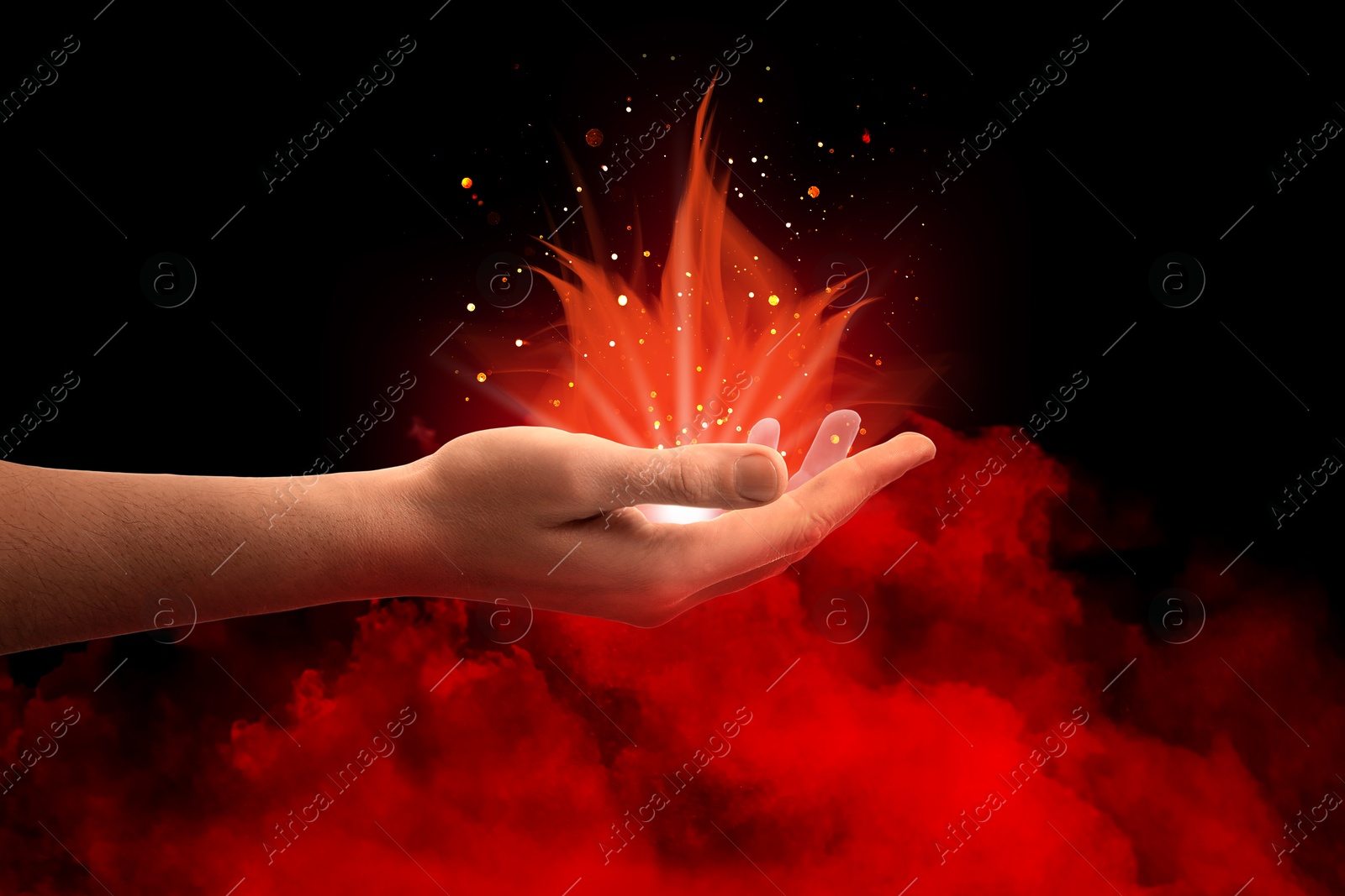 Red magic light as flames coming out of man's hand in smoke against black background. Aura, spiritual practice Image of Red magic light as flames coming out of man's hand in smoke against black background. Aura, spiritual practice