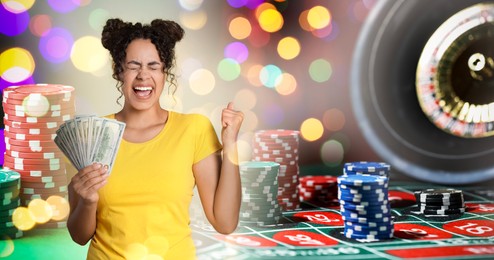 Image of Happy gambler with money fan, casino chips and roulette. Banner design