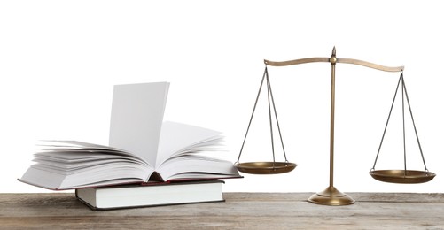 Photo of Golden scales of justice and books on wooden table against white background