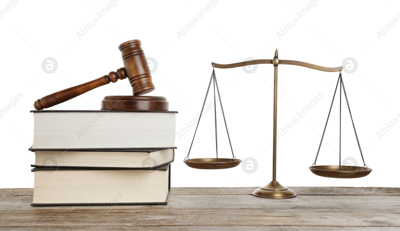 Golden scales of justice, books and gavel on wooden table against white background Photo of Golden scales of justice, books and gavel on wooden table against white background