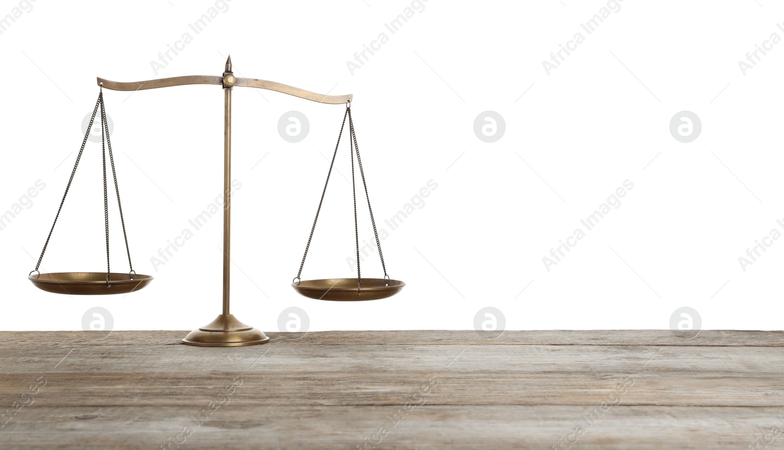 Golden scales of justice on wooden table against white background Photo of Golden scales of justice on wooden table against white background