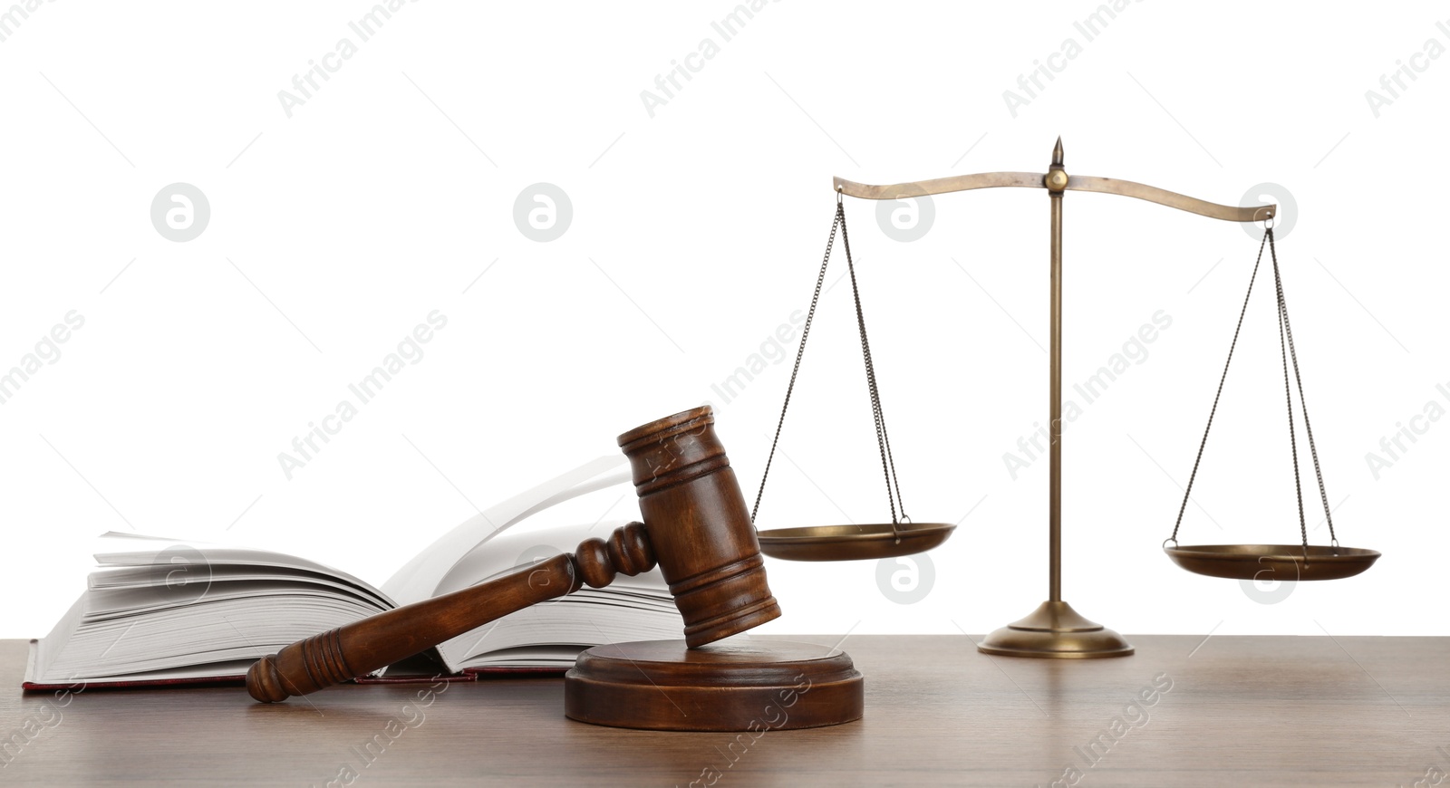 Golden scales of justice, book and gavel on wooden table against white background Photo of Golden scales of justice, book and gavel on wooden table against white background