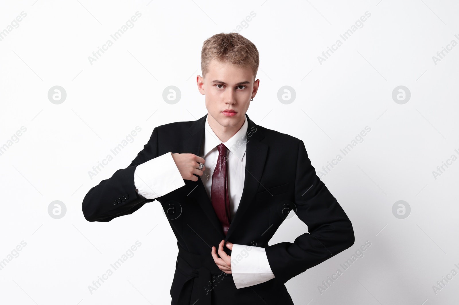 Photo of Handsome young man wearing stylish suit on white background