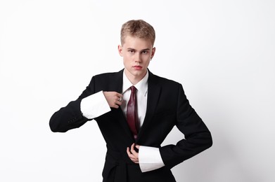 Photo of Handsome young man wearing stylish suit on white background