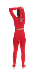 Photo of Teenage girl in sportswear stretching on white background, back view
