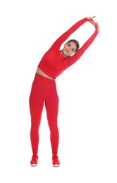 Photo of Teenage girl in sportswear stretching on white background