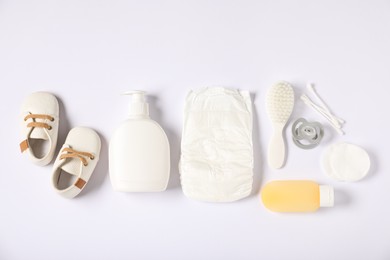 Photo of Baby accessories and cosmetic products on white background, flat lay
