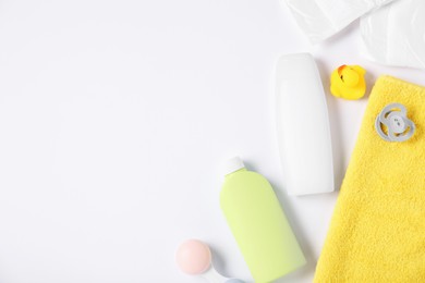 Photo of Baby accessories and cosmetic products on white background, flat lay. Space for text