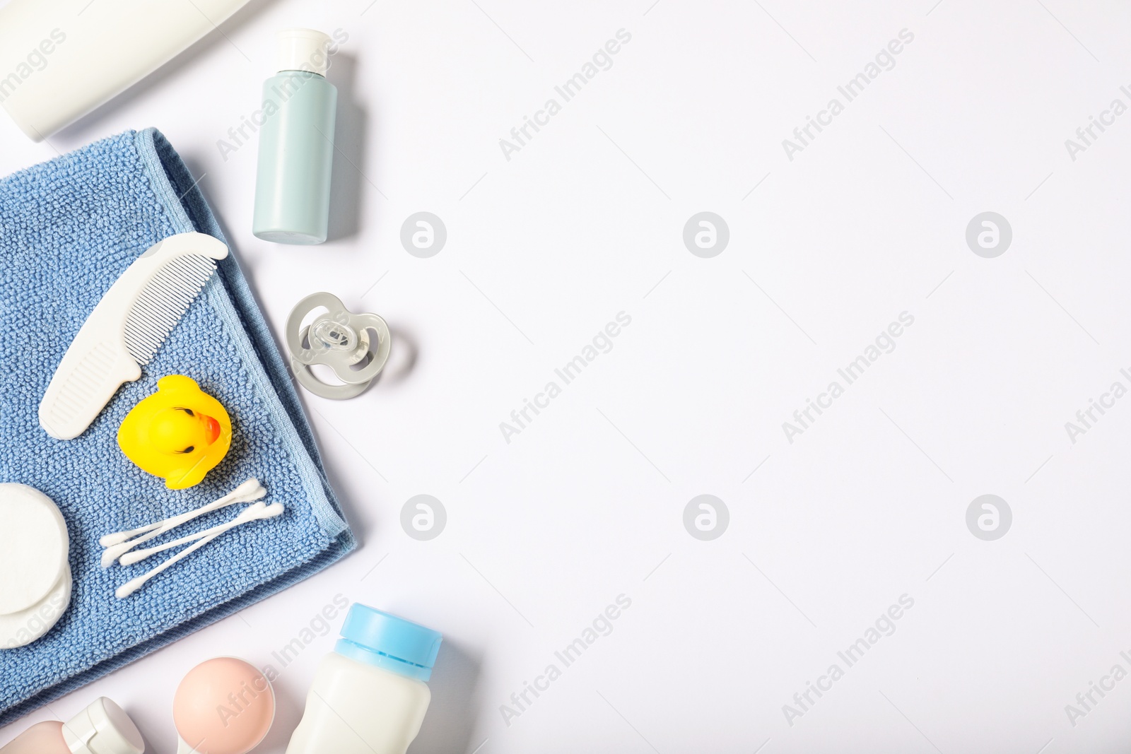 Baby accessories and cosmetic products on white background, flat lay. Space for text Photo of Baby accessories and cosmetic products on white background, flat lay. Space for text