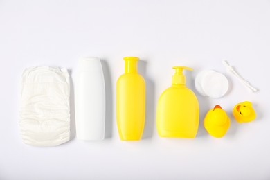 Photo of Baby accessories and cosmetic products on white background, flat lay