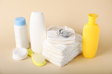 Photo of Baby accessories and cosmetic products on beige background