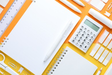 Photo of White stationery on color background, flat lay
