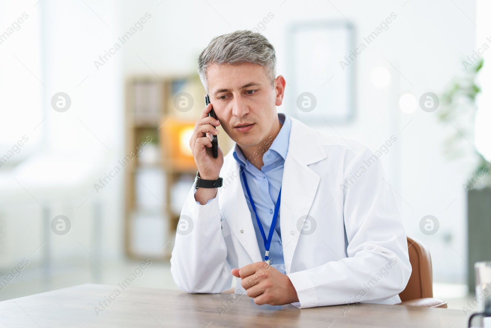 Telemedicine. Doctor having call with patient indoors Photo of Telemedicine. Doctor having call with patient indoors