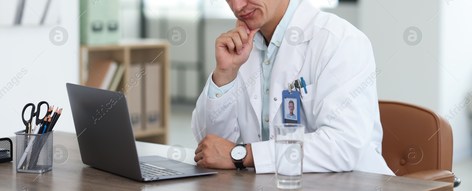 Telemedicine. Doctor having video call with patient via laptop indoors, closeup Photo of Telemedicine. Doctor having video call with patient via laptop indoors, closeup