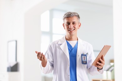 Photo of Telemedicine. Doctor with tablet having video call with patient, view from camera