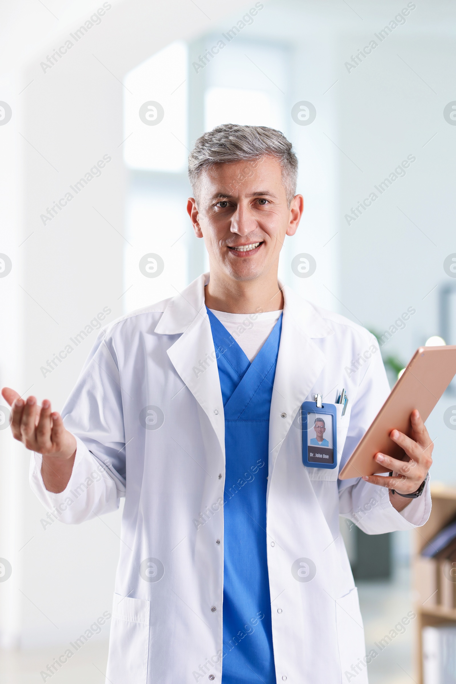 Telemedicine. Doctor with tablet having video call with patient, view from camera Photo of Telemedicine. Doctor with tablet having video call with patient, view from camera