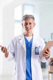Photo of Telemedicine. Doctor with tablet having video call with patient, view from camera