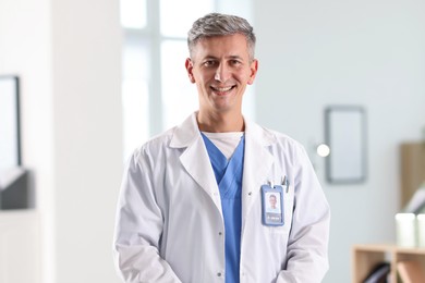 Photo of Portrait of doctor in white coat indoors