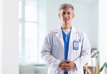 Photo of Portrait of doctor in white coat indoors