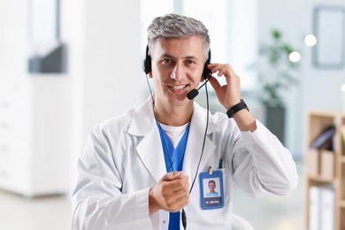 Photo of Telemedicine. Doctor having video call with patient, view from camera