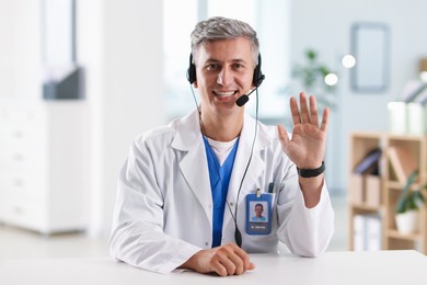 Photo of Telemedicine. Doctor having video call with patient, view from camera