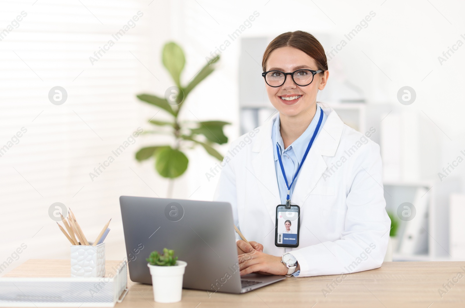 Telemedicine. Doctor having video call with patient via laptop indoors Photo of Telemedicine. Doctor having video call with patient via laptop indoors