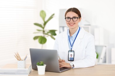 Photo of Telemedicine. Doctor having video call with patient via laptop indoors