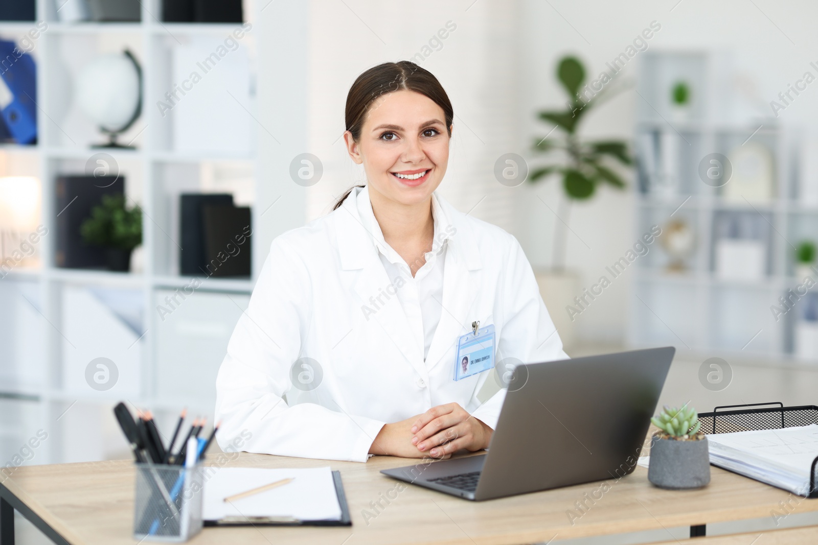 Telemedicine. Doctor having video call with patient via laptop indoors Photo of Telemedicine. Doctor having video call with patient via laptop indoors