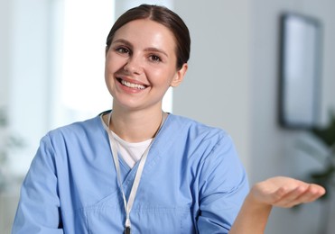 Photo of Telemedicine. Doctor having video call with patient, view from camera