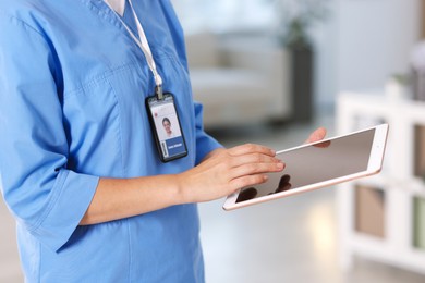 Photo of Telemedicine. Doctor with tablet in office, closeup