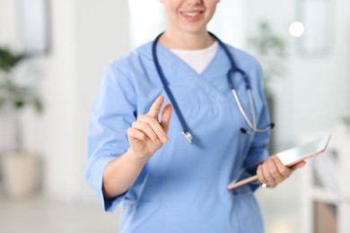Photo of Telemedicine. Doctor with tablet in office, closeup