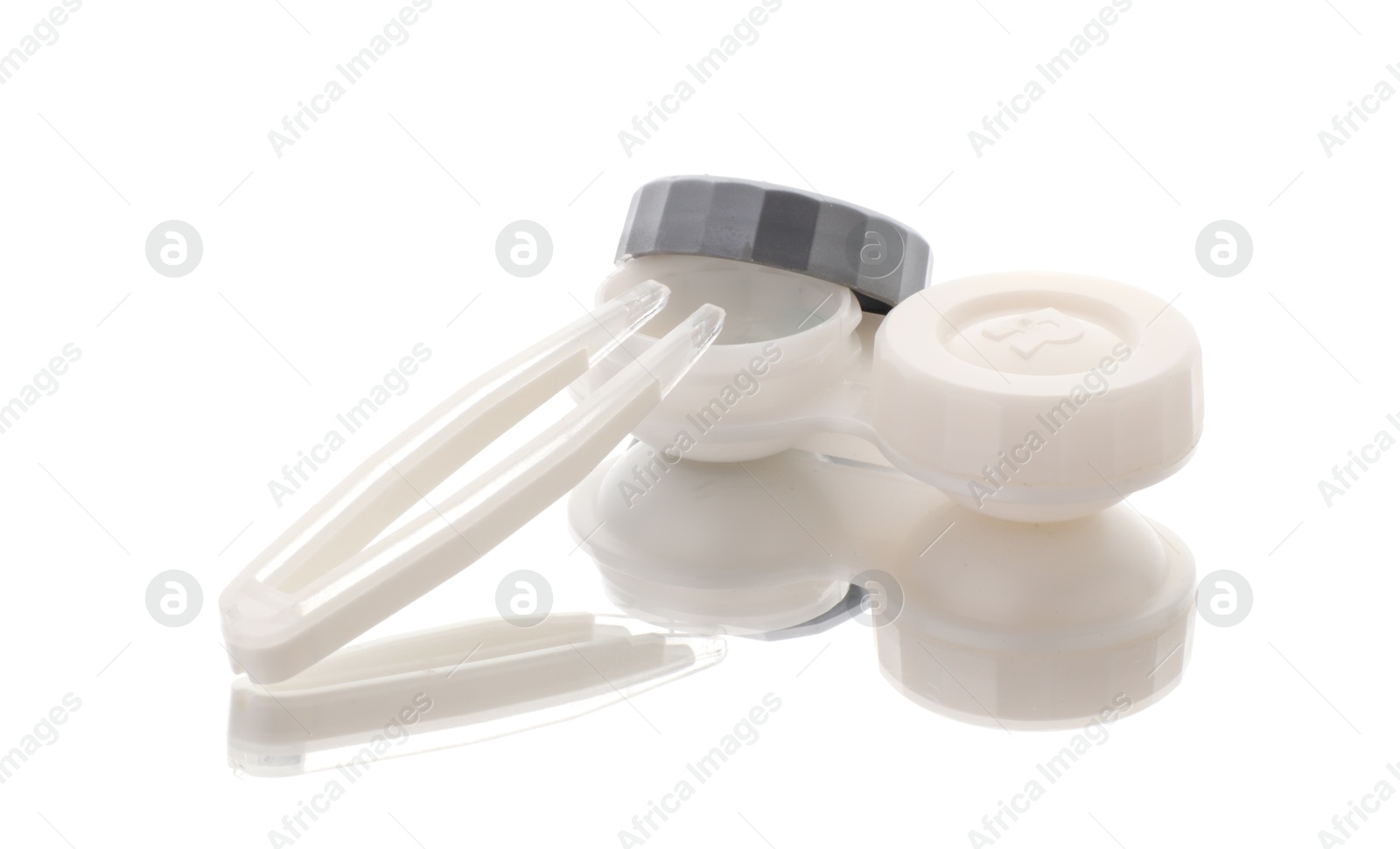 Case with contact lenses and tweezers isolated on white Photo of Case with contact lenses and tweezers isolated on white