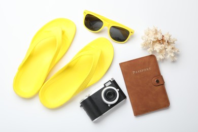 Photo of Time for summer vacation. Camera, passport and beach accessories on white background, flat lay