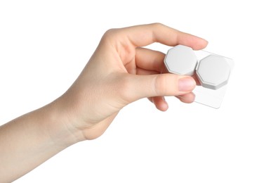 Photo of Woman holding case with contact lenses on white background, closeup