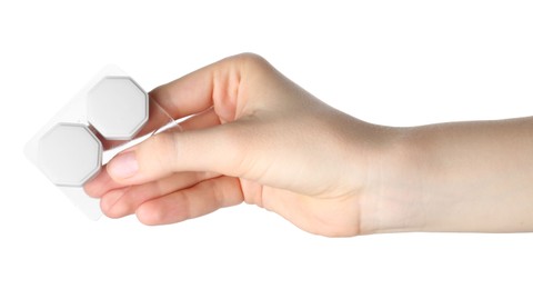 Photo of Woman holding case with contact lenses on white background, closeup