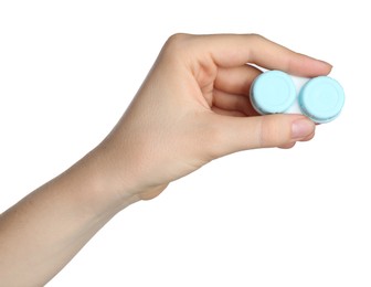 Photo of Woman holding case with contact lenses on white background, closeup