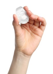 Photo of Woman holding blister pack with contact lens on white background, closeup