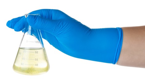 Photo of Scientist holding flask with dirty water on white background, closeup