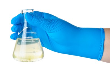 Photo of Scientist holding flask with dirty water on white background, closeup