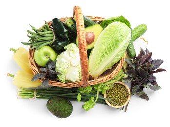 Photo of Superfood. Healthy food products in wicker basket isolated on white, top view